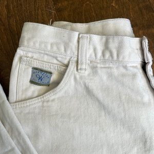 White Wrangler jeans. High-waisted, full length and slightly tapered.